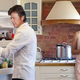 The man who once played the role of a pansexual alien and came to drunken blows with Lou Reed in a restaurant, looks through the fridge with his wife, a Somali supermodel.
